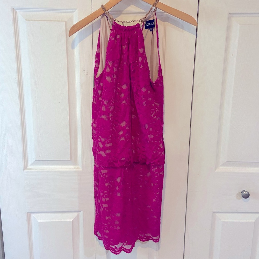 Magenta lace cocktail dress with chain neckline.